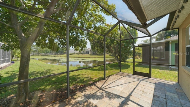 unfurnished sunroom with a water view