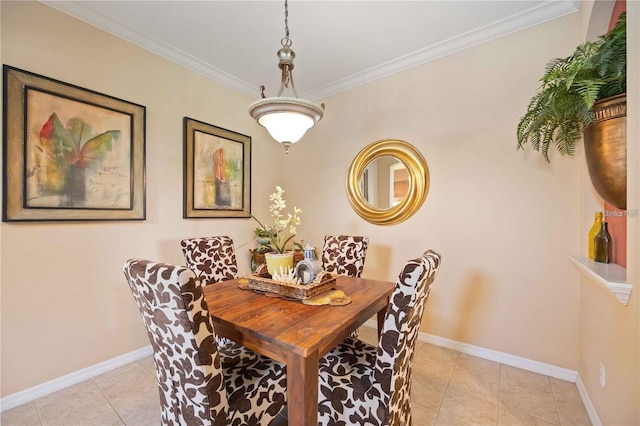 dining space featuring light tile patterned floors, baseboards, and crown molding