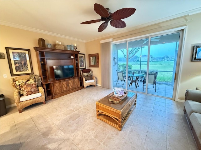 living area with baseboards, ornamental molding, a ceiling fan, and light tile patterned flooring