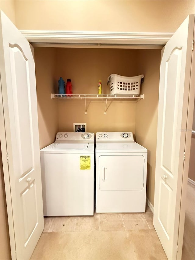 clothes washing area featuring laundry area and independent washer and dryer