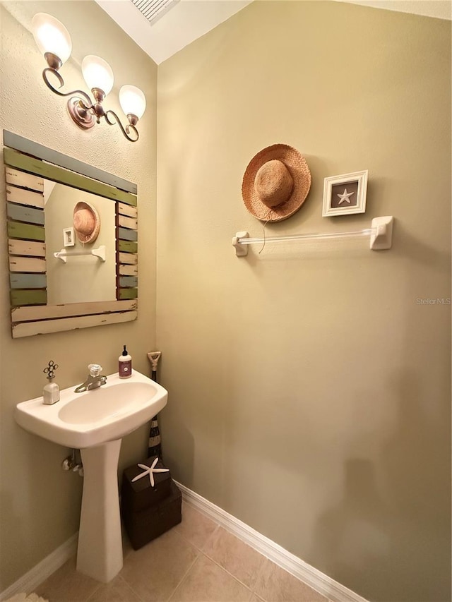 bathroom featuring tile patterned flooring and baseboards