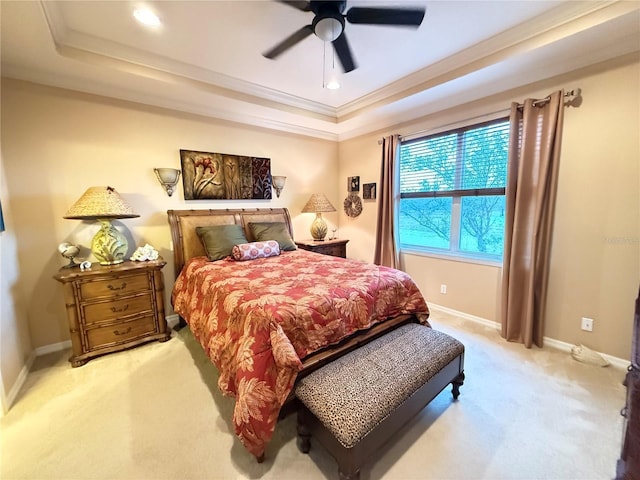 carpeted bedroom with ornamental molding, recessed lighting, a raised ceiling, and baseboards