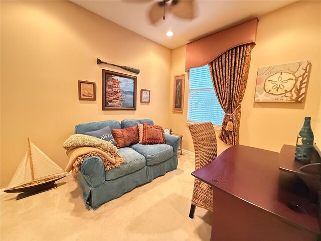 office space with recessed lighting, ceiling fan, baseboards, and light colored carpet