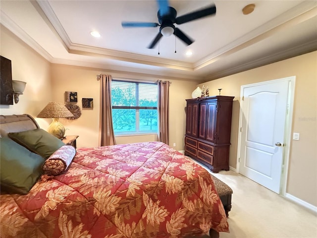 bedroom with light carpet, baseboards, a raised ceiling, and crown molding