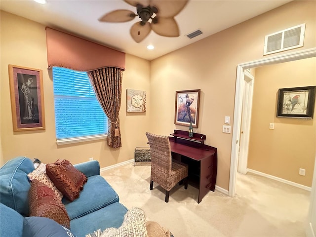 office featuring light carpet, visible vents, and baseboards