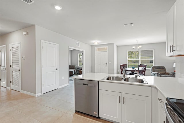 kitchen with white cabinetry, stainless steel appliances, a sink, and light countertops