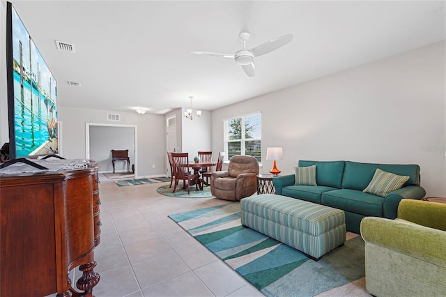 living room featuring light tile patterned floors, visible vents, and a ceiling fan