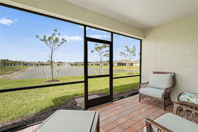 sunroom featuring a residential view