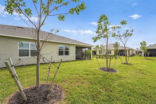 view of yard featuring a sunroom