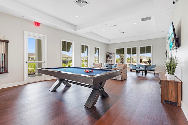 game room featuring baseboards, visible vents, a raised ceiling, and dark wood-type flooring