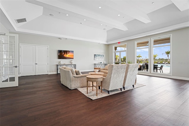 living area featuring recessed lighting, dark wood-type flooring, visible vents, baseboards, and beamed ceiling