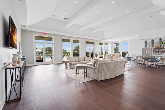 living area featuring visible vents, dark wood-style flooring, a wealth of natural light, and french doors