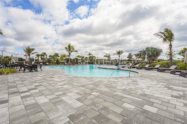 community pool featuring a patio area