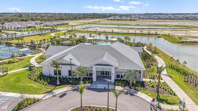 bird's eye view featuring a water view and a residential view