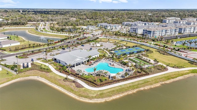 birds eye view of property with a water view