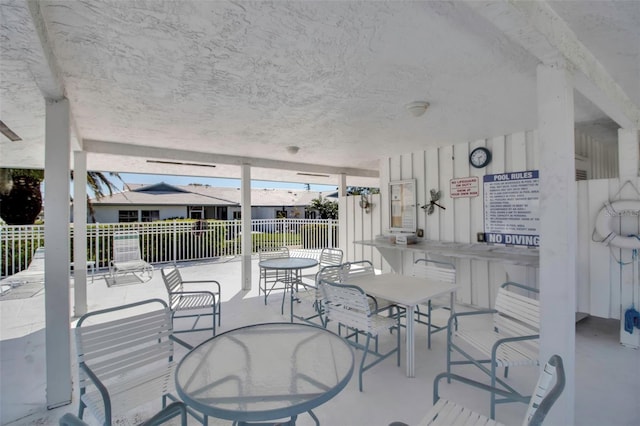 view of patio / terrace featuring outdoor dining space and fence