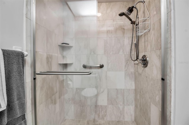 bathroom featuring a shower stall