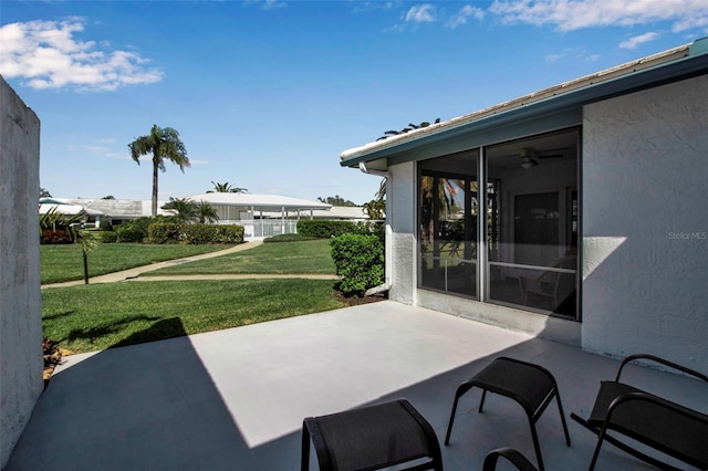 view of patio / terrace featuring a sunroom