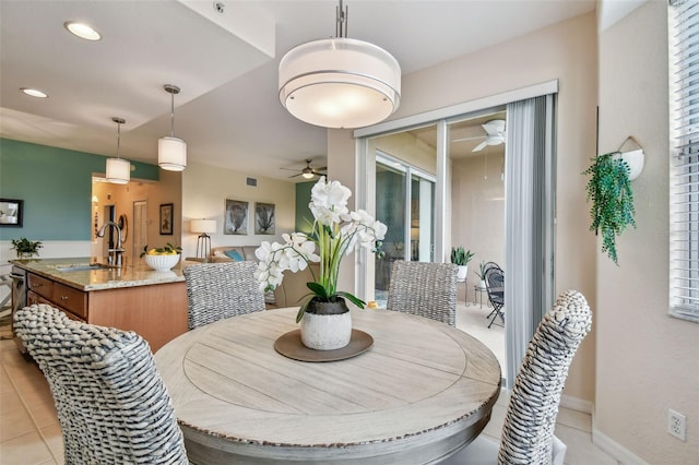 dining room with baseboards, light tile patterned flooring, a ceiling fan, and recessed lighting