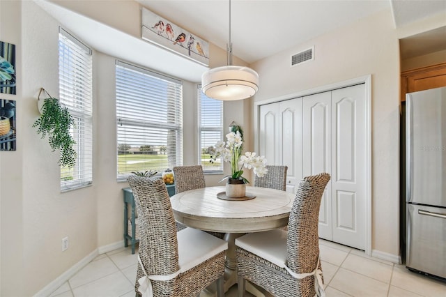 dining room with visible vents, baseboards, and light tile patterned floors