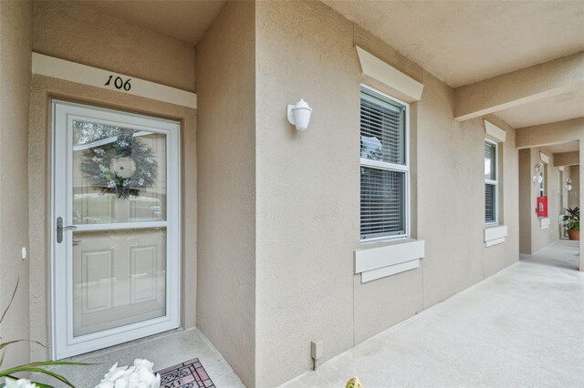 property entrance featuring stucco siding