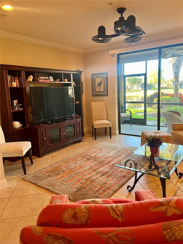 tiled living room with visible vents, crown molding, baseboards, and ceiling fan