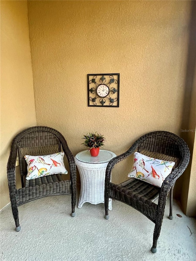 living area featuring carpet floors