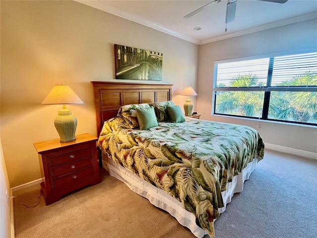 bedroom with light carpet, baseboards, a ceiling fan, and crown molding