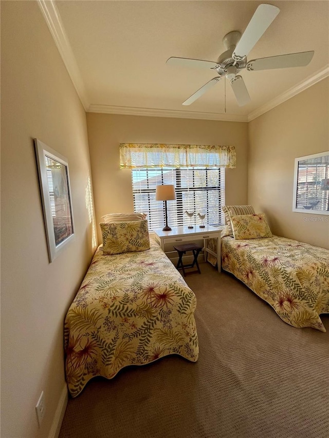 carpeted bedroom with ornamental molding and a ceiling fan