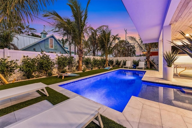 view of pool featuring a patio area, a fenced backyard, and a fenced in pool