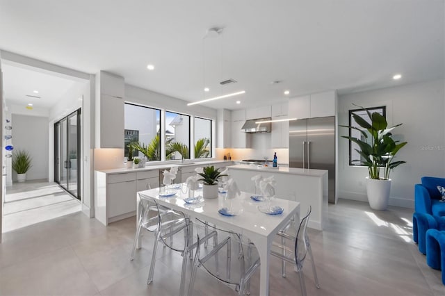 dining area with recessed lighting, visible vents, and baseboards