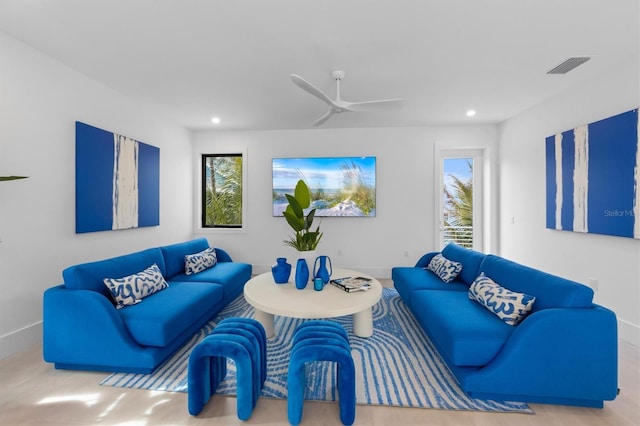 living room with ceiling fan, baseboards, visible vents, and recessed lighting