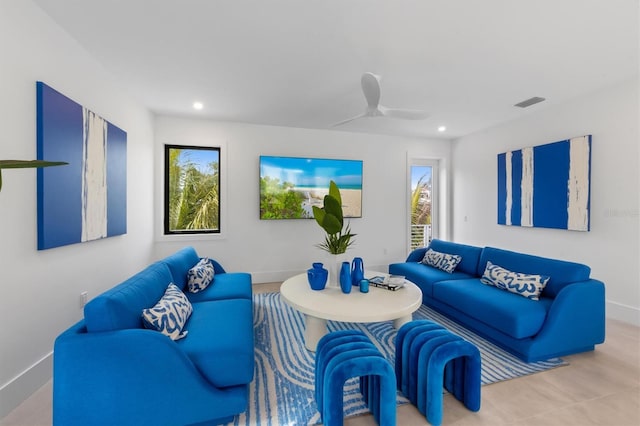 living area featuring recessed lighting, visible vents, ceiling fan, and baseboards