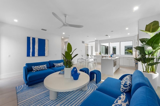 living room featuring recessed lighting, visible vents, and ceiling fan