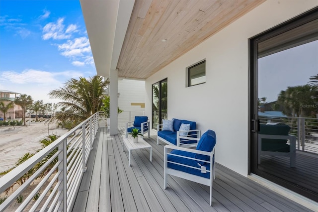 wooden terrace featuring an outdoor hangout area