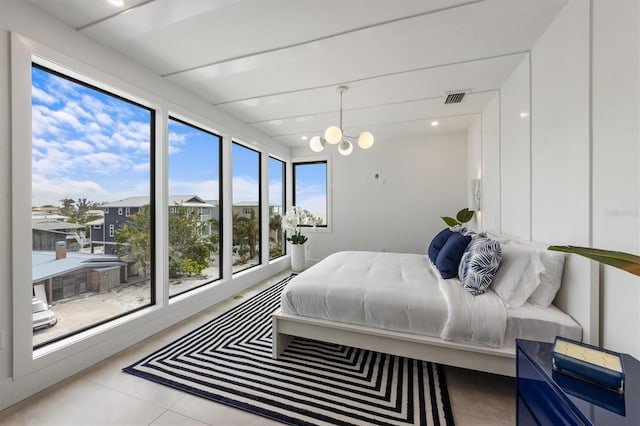 bedroom with light tile patterned floors, visible vents, a chandelier, and recessed lighting