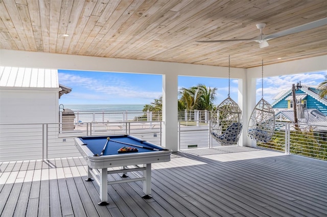 wooden terrace featuring a water view and ceiling fan