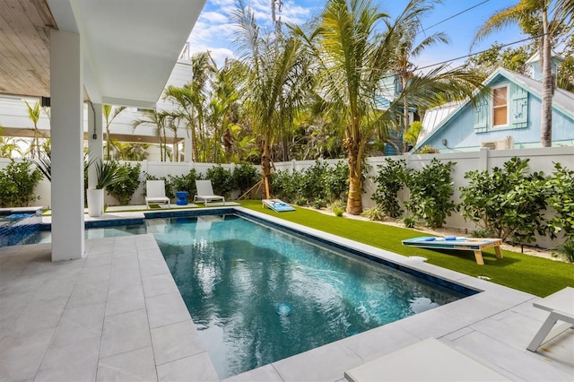 view of pool with a lawn, a patio area, a fenced backyard, and a fenced in pool