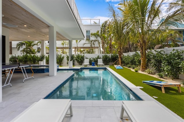 view of pool with a patio area, a fenced backyard, a fenced in pool, and a yard