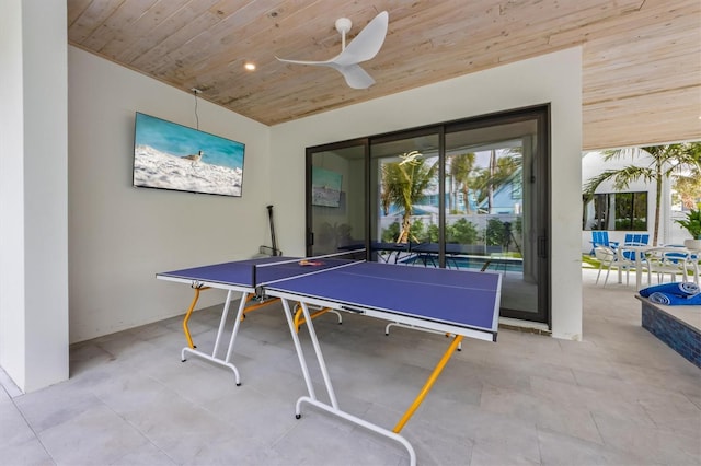 recreation room featuring wood ceiling and ceiling fan