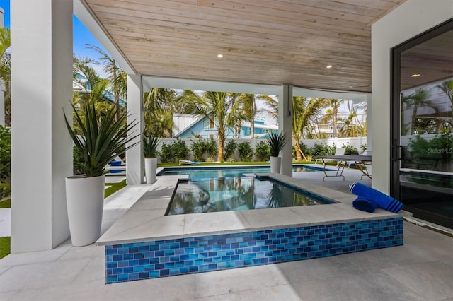 view of pool with a fenced in pool, a patio, and fence