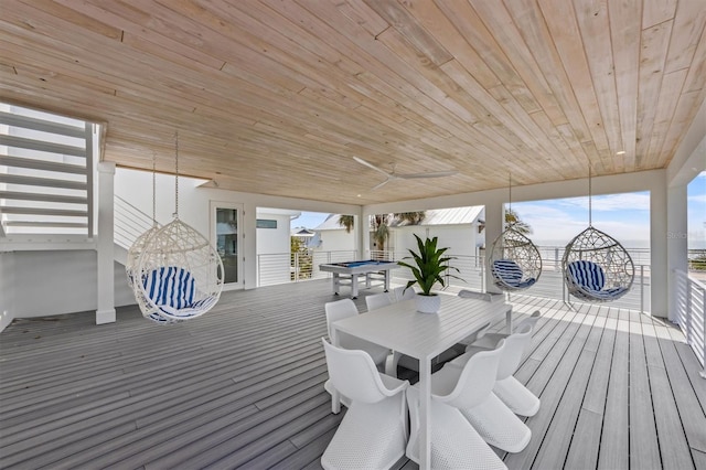 deck featuring ceiling fan and outdoor dining space