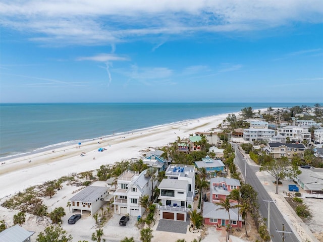 birds eye view of property with a view of the beach and a water view