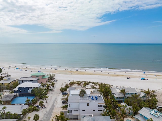 birds eye view of property featuring a view of the beach and a water view