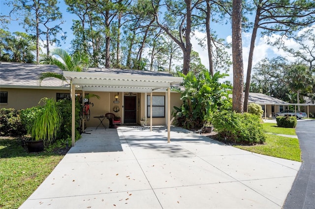 view of front of home featuring stucco siding