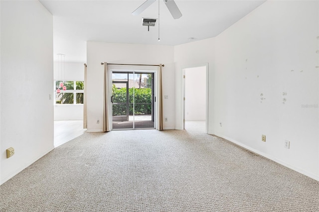 empty room with light carpet, baseboards, visible vents, and a ceiling fan