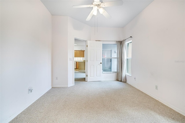 unfurnished bedroom featuring carpet flooring, a ceiling fan, and baseboards