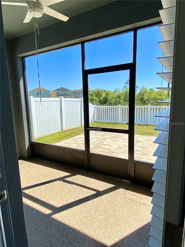 unfurnished sunroom with a water view