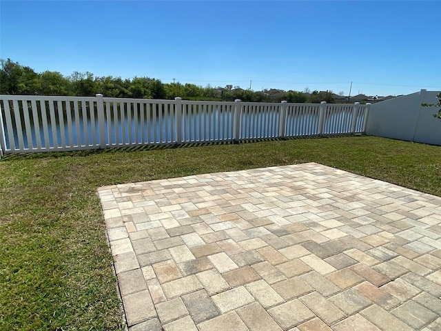 view of patio / terrace featuring fence