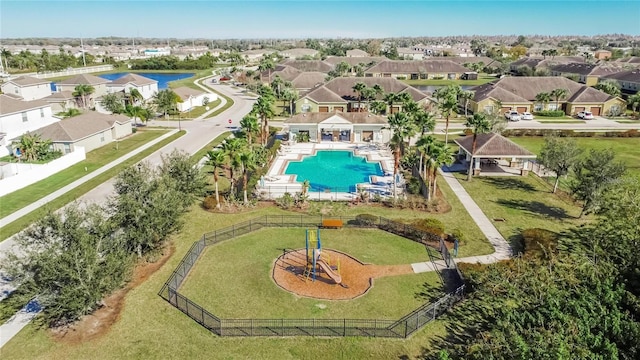 drone / aerial view featuring a water view and a residential view